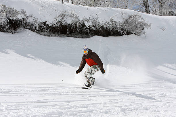 Snowboarding Freestyle Fun Riding Fast on a Mountain Slope