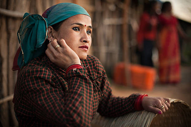istock Serene, traditional Asian peasant woman looking away and thinking. 609442032