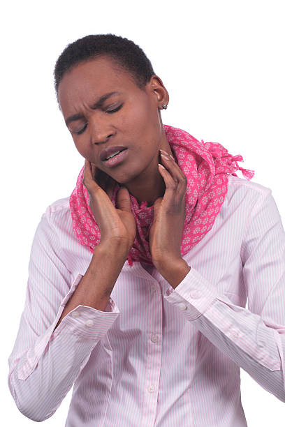 istock African woman with sore throat 609443736