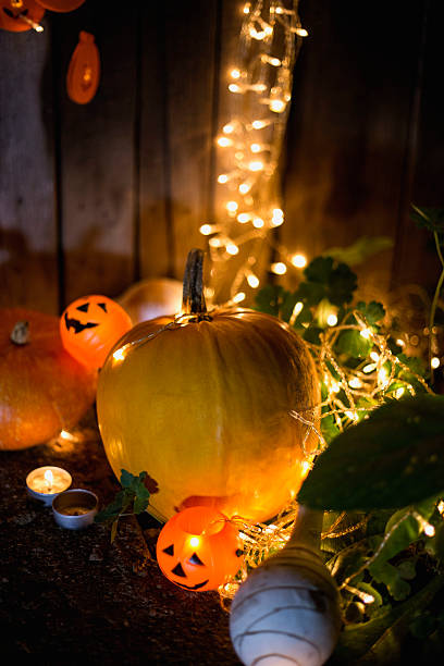 istock Halloween pumpkin head jack lantern on wooden background 609444318