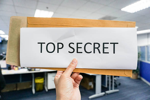 istock Hold paper of top secret 609532096
