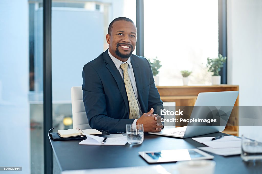 I take pride in my work Portrait of a corporate businessman working in the office African Ethnicity Stock Photo