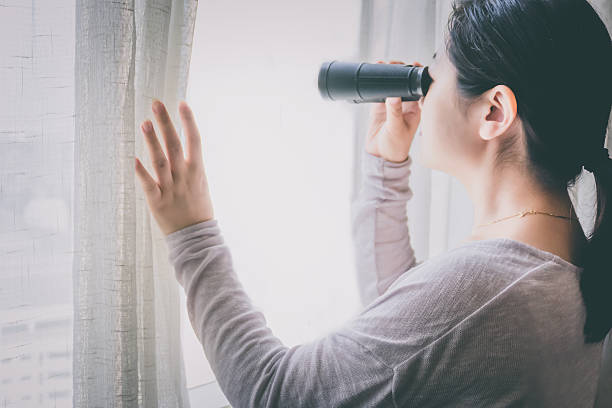 istock Businesswoman look through binoculars 609625160