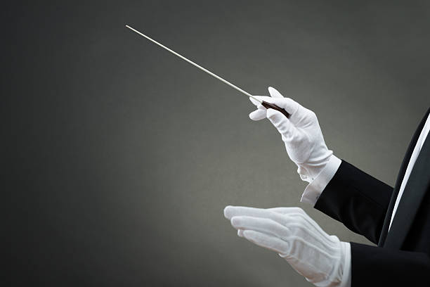 istock Music Conductor's Hand Instructing With Baton 609625912