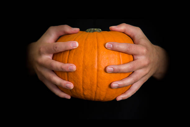 Hands holding a Halloween  pumpkin,