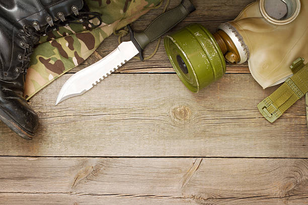 istock Military accessories on wooden boards 609628808