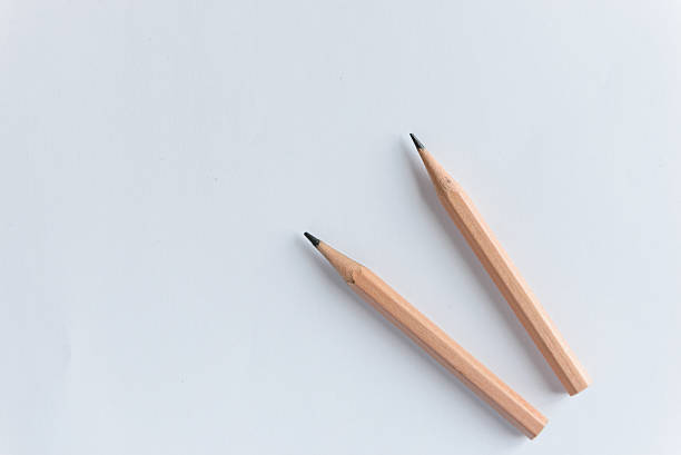 istock Wooden Pencils on white paper with copy space 609683492