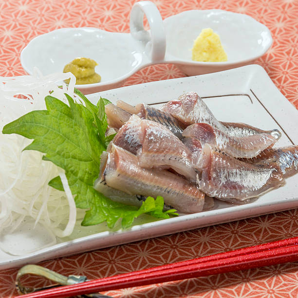 istock Fresh raw sardine fish fillet with herbs and wasabi 609683596