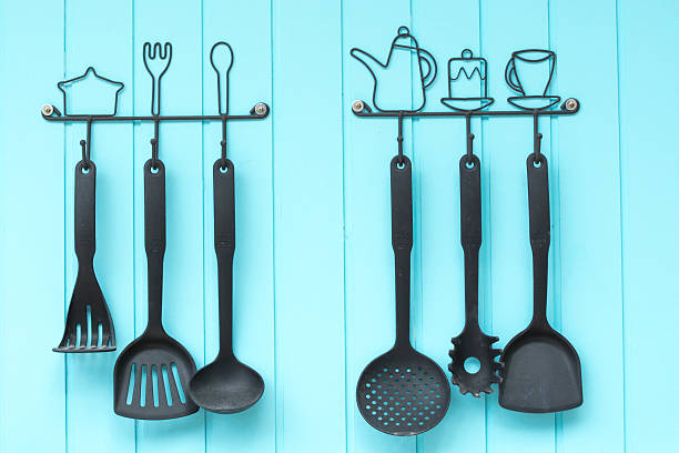 istock ladles hanging on the wall. 609684916