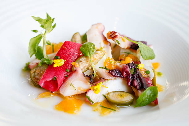 istock Sauteed sliced octopus, smoked sunchoke, breakfast radish and he 609686532