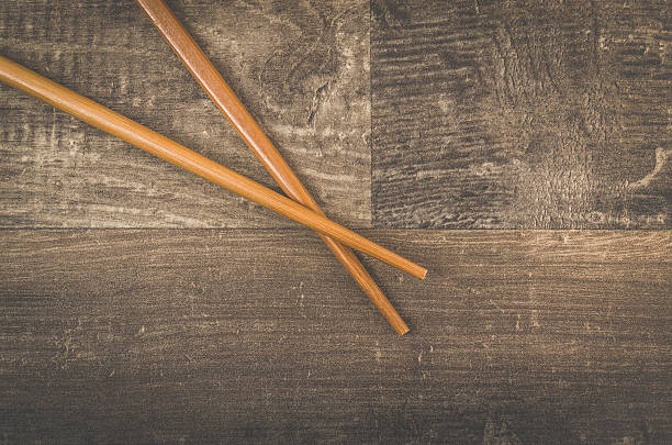 istock Asian chopsticks on wooden table 609687504