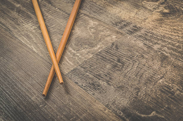 istock Asian chopsticks on wooden table 609687600