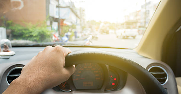istock Driver eye view with hand on wheel in vintage style 609688898