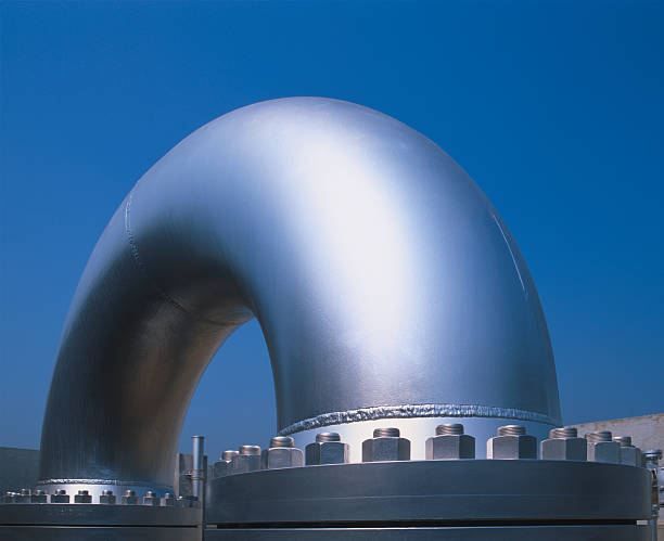 Huge curved metallic pipe in a gas distribution plant