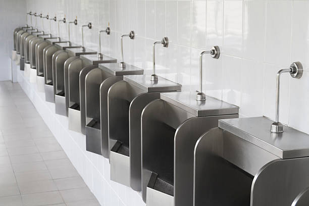 istock Pattern of urinals for men 609690494