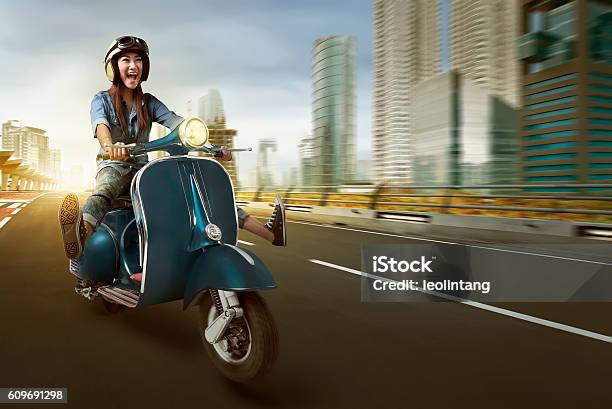 Asian Woman Riding Scooter And Wearing Helmet Stock Photo - Download Image Now - Motorcycle, Motor Scooter, Women