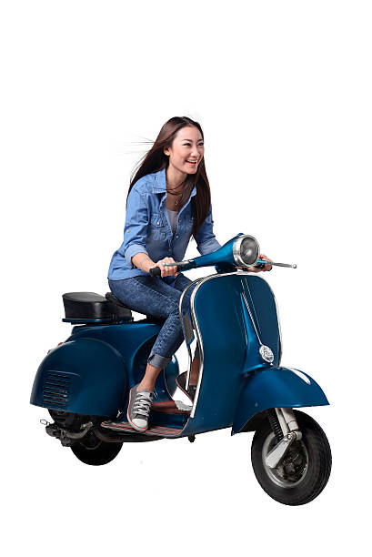 istock Asian woman riding scooter 609691408