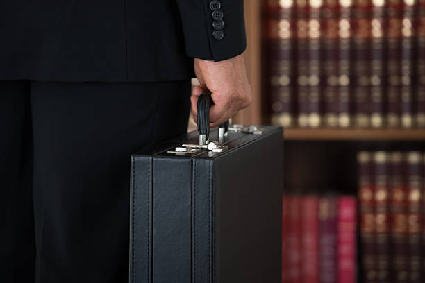 istock Businessman Carrying Briefcase In Office 609692378
