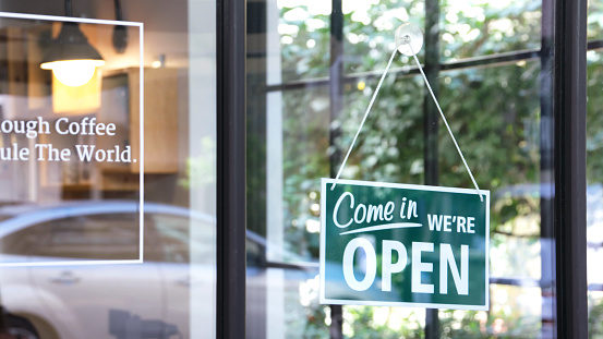 Open sign in a coffee shop.