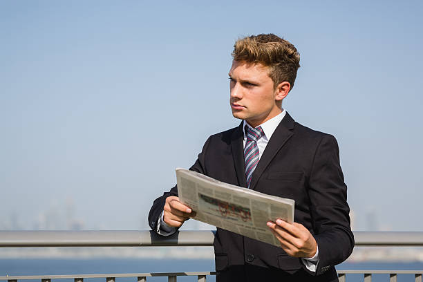 istock Young success manager staying outdoor  front the cityscape. 609692864