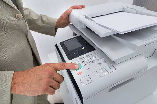 istock Midsection Of Businessman Pressing Printer's Button 609692916