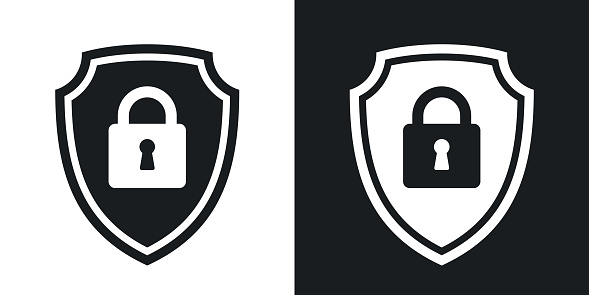 Two-tone version of vector Protective shield icon with the image of a padlock. Security concept simple icon on black and white background
