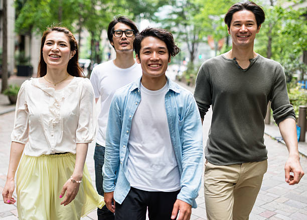 istock japanese friends walking in tokyo 609694234