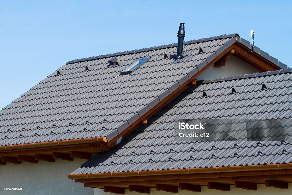 roof modern roof of a detached house against the blue sky Rooftop Stock Photo