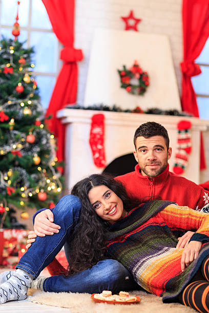 istock Smiling young couple leaning on ground and resting at home 609695254
