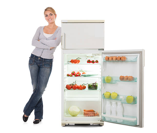 istock Woman With Arms Crossed Leaning On Open Refrigerator 609695436
