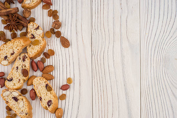 istock Cookies with almonds and raisins on the old wooden table. 609696082