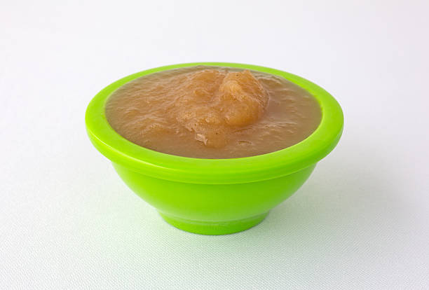 istock Cinnamon applesauce in a green bowl on a tablecloth 609696442