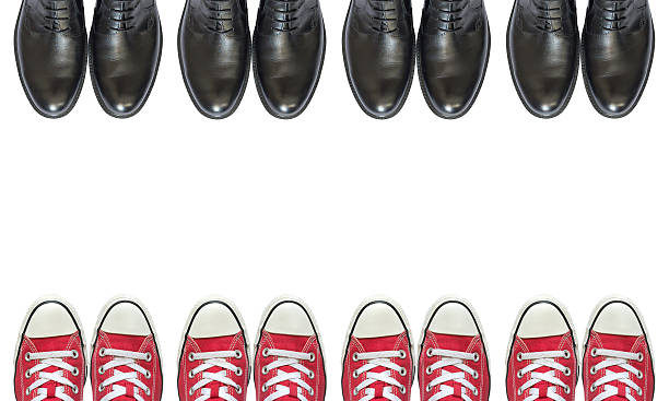 istock red sneakers and man business shoes 609696612