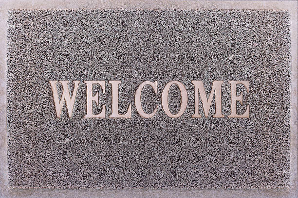 istock Welcome Door Mat Isolated. Friendly Grey Door Mat Closeup. 609696758