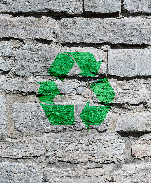 istock Recycle symbol on urban wall 609697262