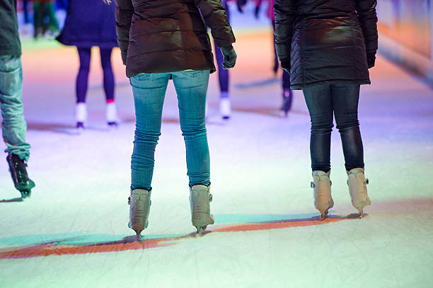 istock People ice skating at night in Vienna, Austria. Winter. 609698094