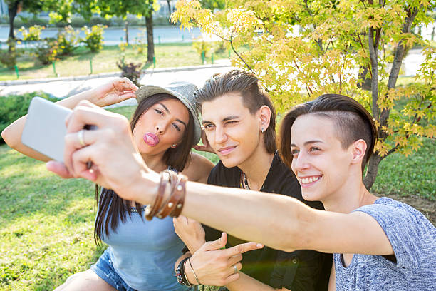 istock Happy friends taking selfie in the park. 609699054
