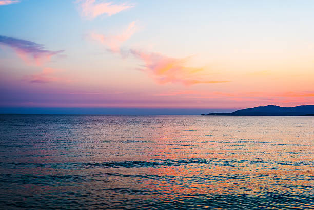 istock orange and pink sky over Capo Caccia 609699874