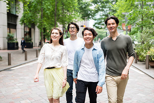 istock japanese friends walking in tokyo 609701542