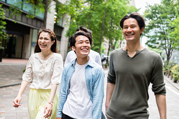 istock japanese friends walking in tokyo 609701682