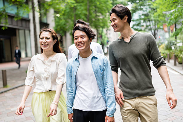 istock japanese friends walking in tokyo 609701858