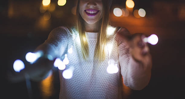 istock Light bulbs and a girl 609702162