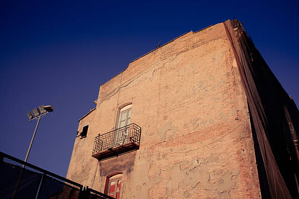istock old house on abandoned area. 609702454