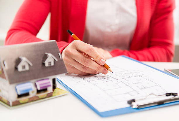 istock Woman with house sketch 609703898