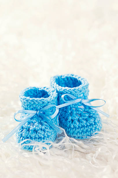 istock Blue baby crochet shoes 609709200