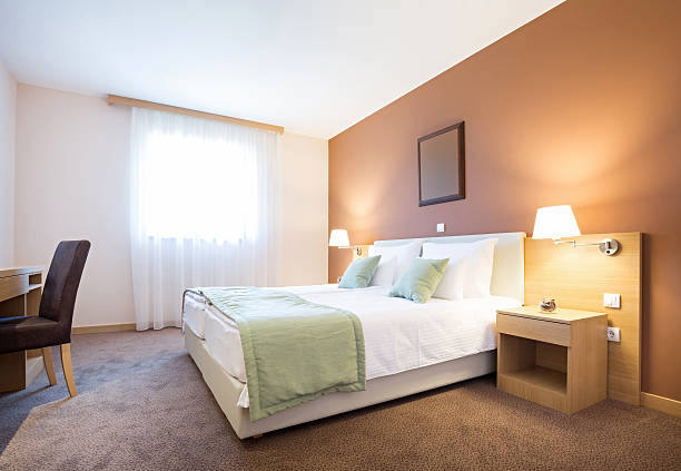 istock Modern beautiful hotel bedroom interior 609710436