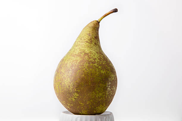 istock Ripe pear on the porcelain form 609711462