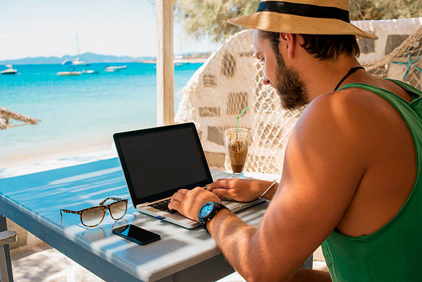istock young man working on his laptop with a nice view 609712132