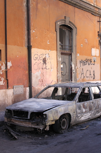 Rome, Italy - October 16, 2011: Devastation of cars by black block groups during the Indignatos demostrations on October 16, 2011 in Rome, Italy