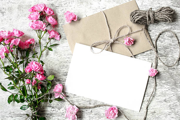 istock blank white greeting card with pink roses bouquet and envelope 609718190